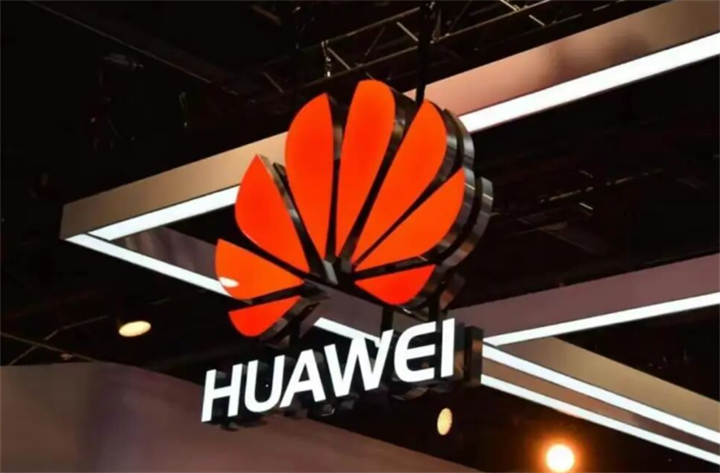 Illuminated Huawei brand signage at tech exhibition venue