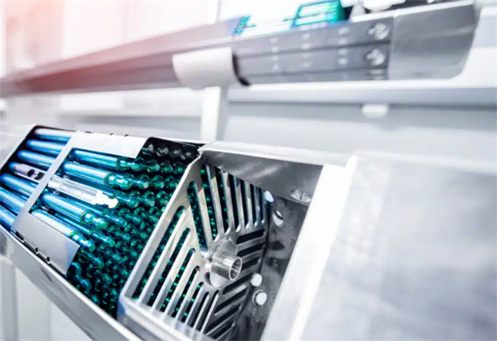 Close-up of encapsulated thorium fuel rod production machinery