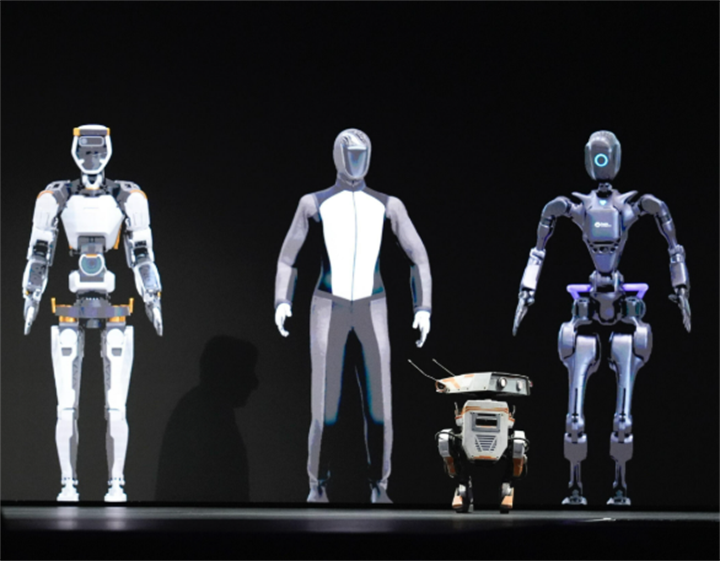 Multiple humanoid and small quadruped robot models displayed side-by-side on presentation stage
