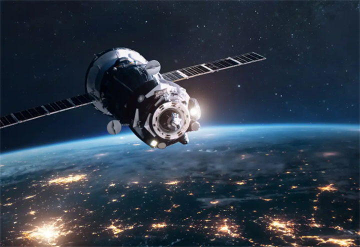 Crewed space capsule orbiting above nighttime Earth with sprawling city lights, on-orbit servicing spacecraft