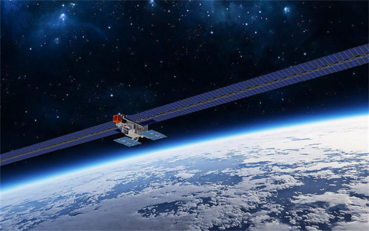Large solar-paneled communications satellite cruising above global cloud cover in outer space