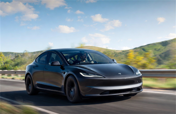 Revised black Tesla Model 3 sedan cruising on scenic rural highway showcasing daily FSD road operating scenario