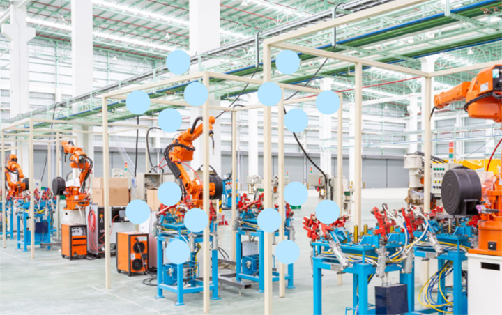 Industrial robot arms on an automated factory assembly line